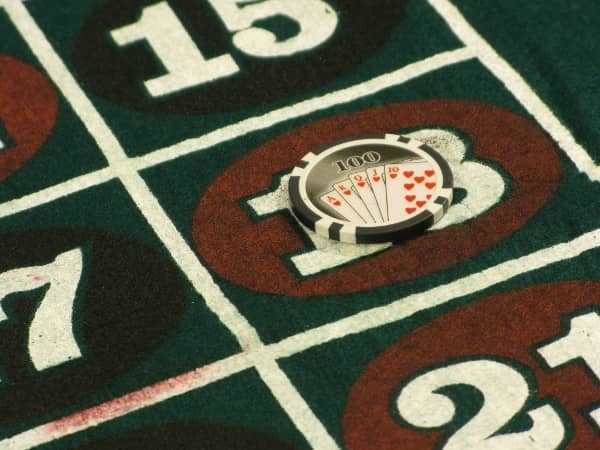 A hundred dollar chip on the number 18 on roulette