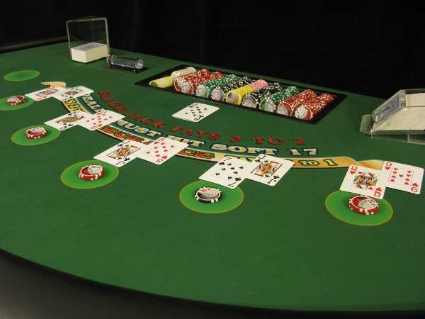 The blackjack table is full of people