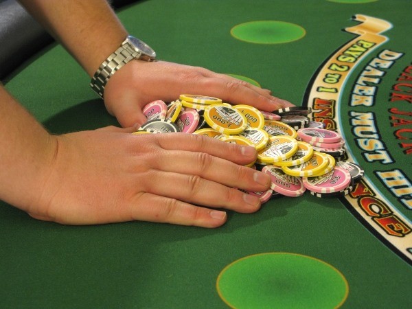 The player is pushing a pile of chips The player is pushing a pile of chips