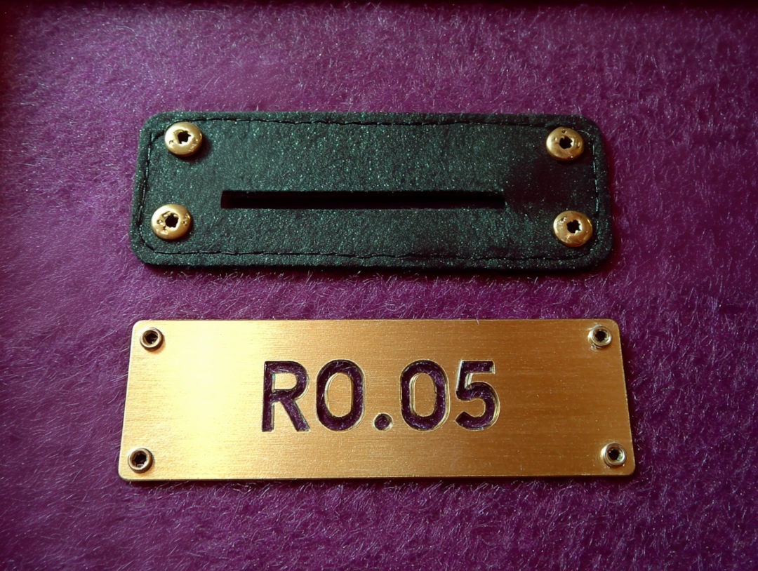 The name plate on the table that marks the table game and number