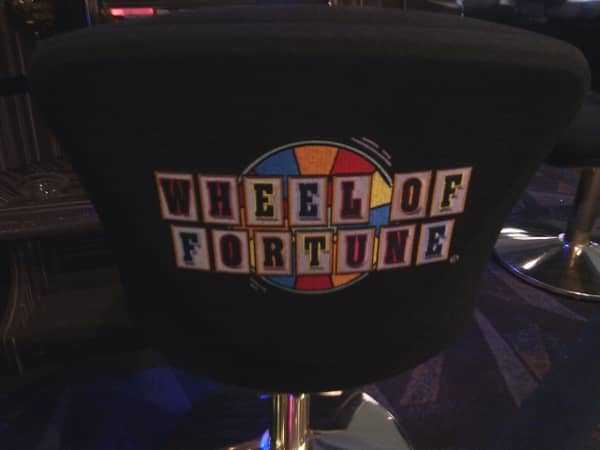 The Wheel of Fortune logo on the back of a chair