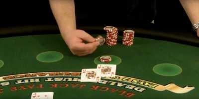 The player is handling chips above their bet