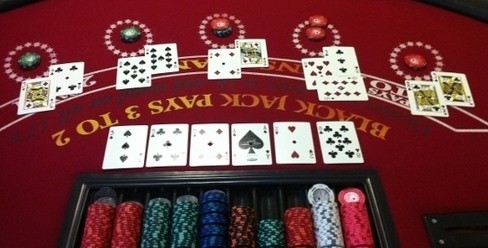 A blackjack table full of multi-colored bets A blackjack table full of multi-colored bets