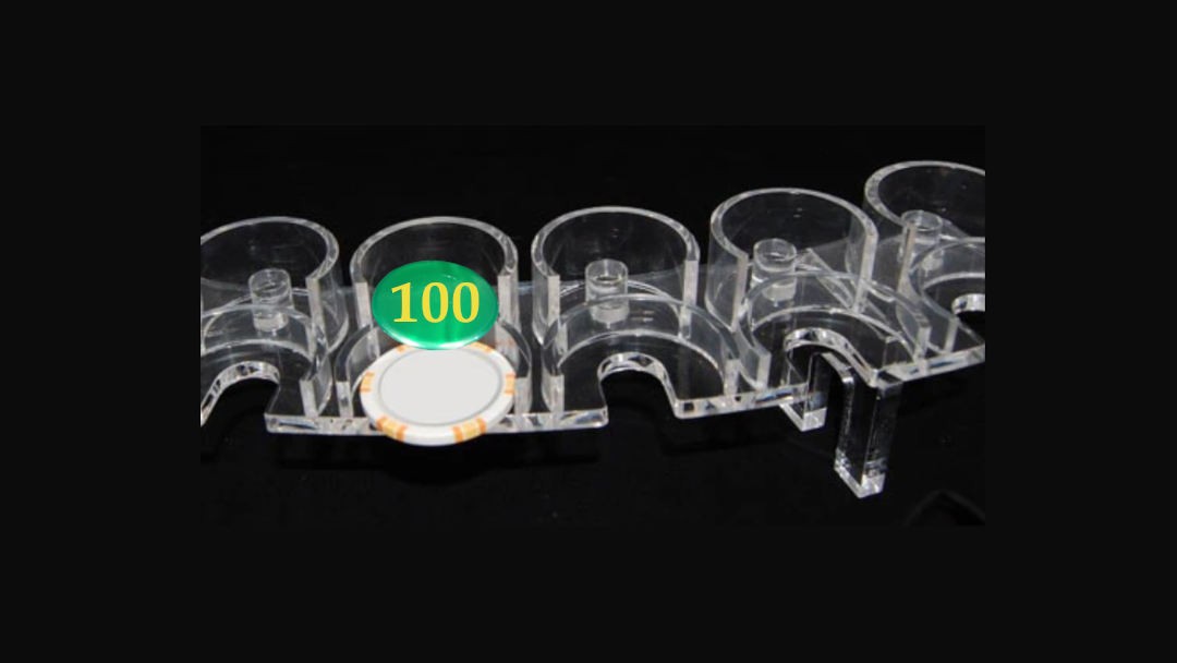 Roulette chip rack with a lammer above the chip