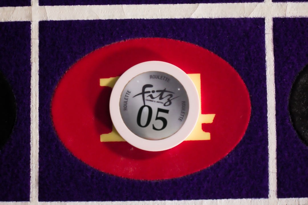 A roulette chip with the table number on it