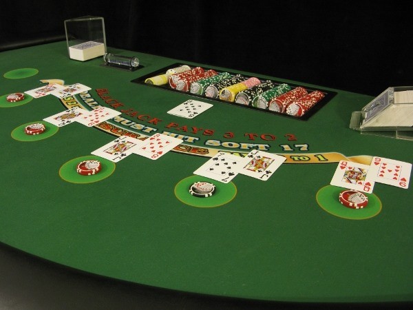 The blackjack table is full of people The blackjack table is full of people