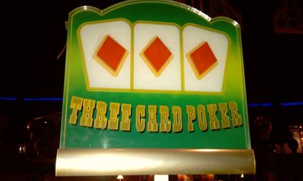 The Three Card Poker sign