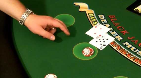 The player should execute the hand signal behind or besides their bet