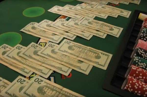 Cash spread out on a blackjack table