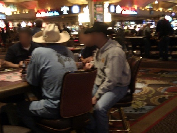 A few cowboys playing roulette A few cowboys playing roulette