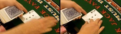 The dealer uses the middle finger to flip the card The dealer uses the middle finger to flip the card