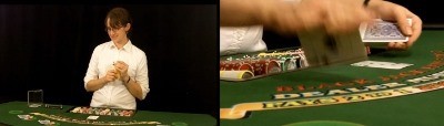 The dealer uses the middle finger to flip the card The dealer uses the middle finger to flip the card