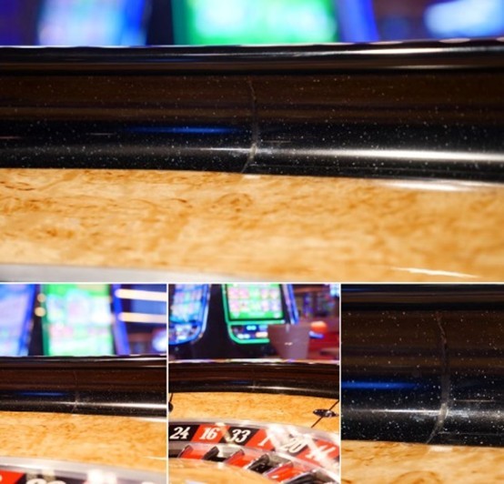 A close up of a roulette wheel with nicks and dents